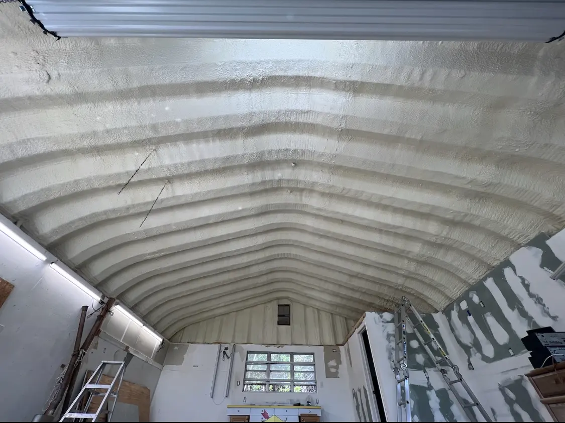 Spray polyurethane foam applied to the underside of a metal roof deck in Brookhaven